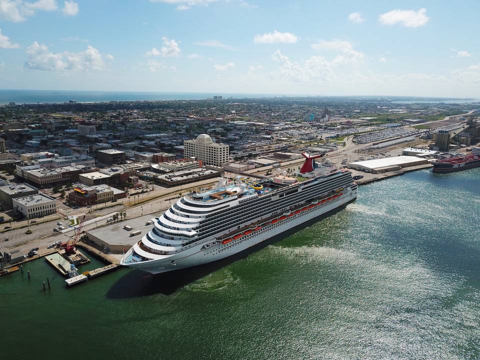 aerial of a cruise ship docked at the Port of Galveston